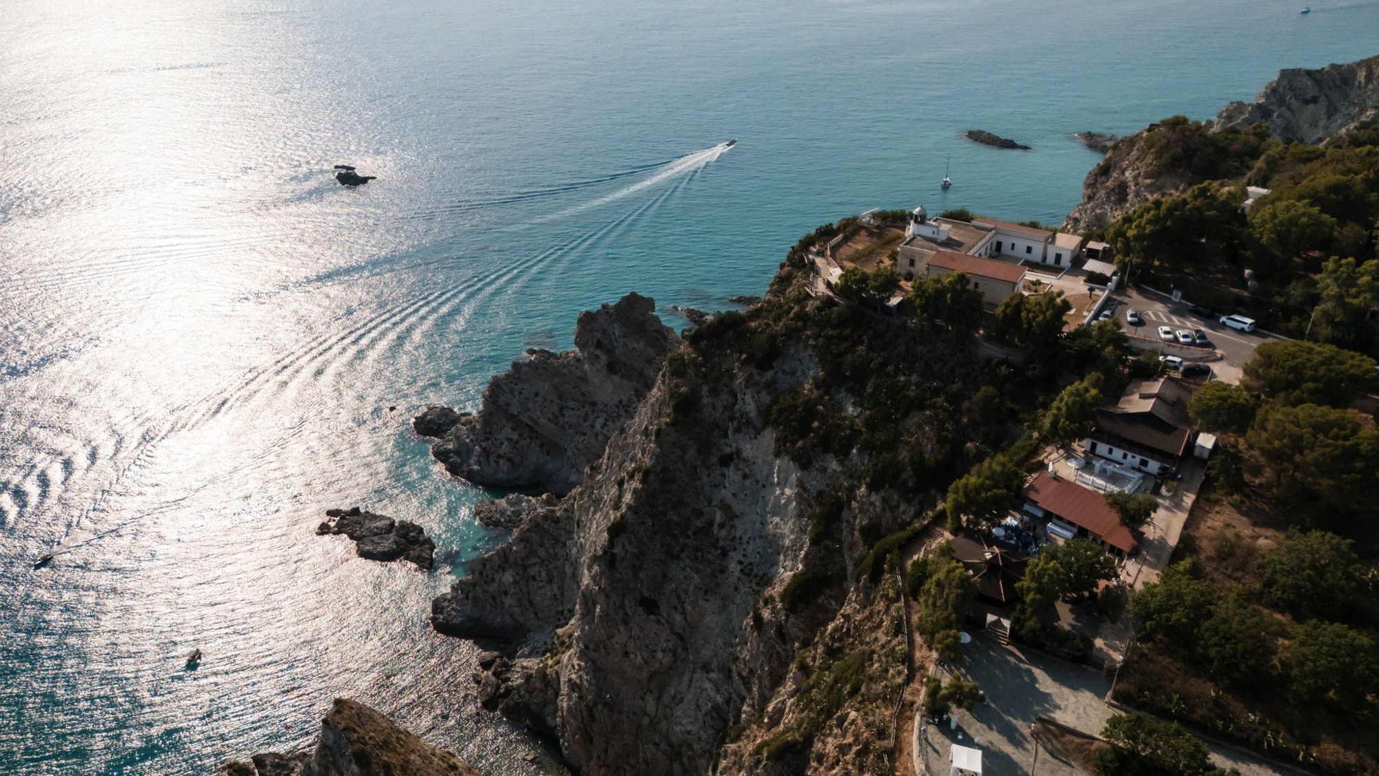 Cliffs and boats along the coast