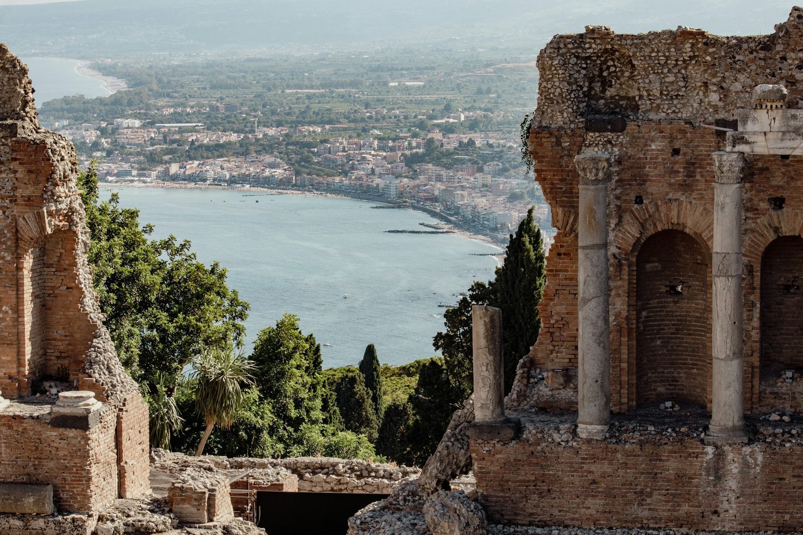 The bay of Taormina seen through the ancient theatre